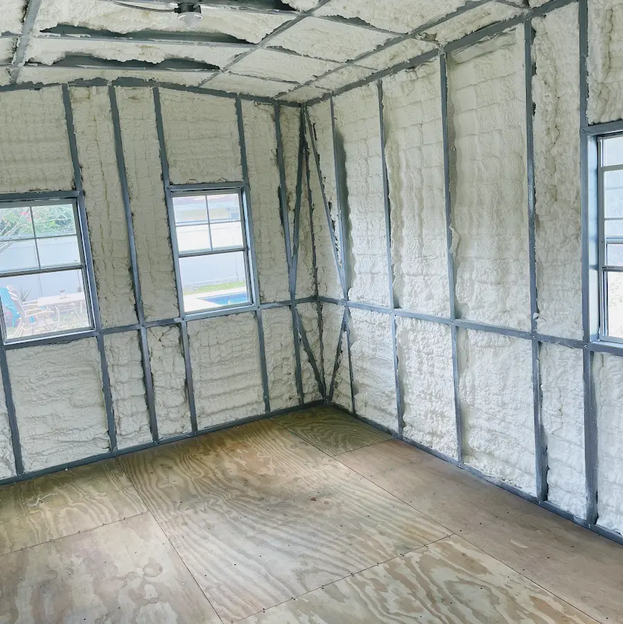 Closed-cell spray foam insulation applied to wall cavities in a residential project in Ammon